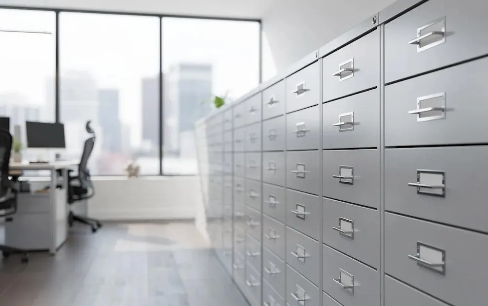 Row of metal filing cabinets in an office