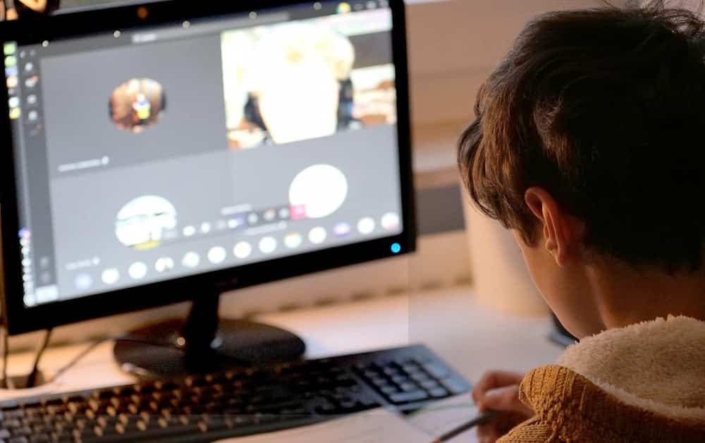 child in front of monitor