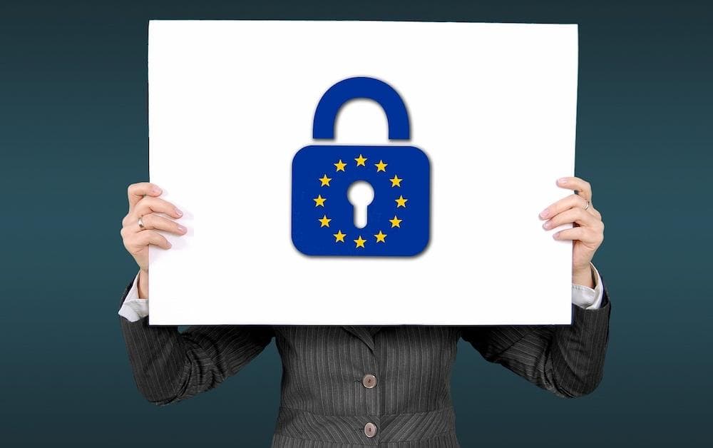 woman holding sign of lock